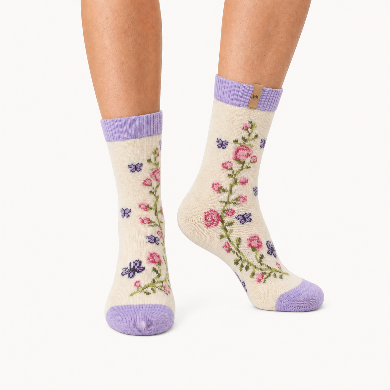 Butterfly Garden merino wool crew socks for women, a climbing rose vine and butterflies with lilac at the cuff and toe
