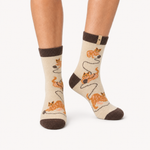 Curious Cats merino wool crew socks for women, a ginger cat and a ball of yarn on cream with chocolate at the cuff and heel