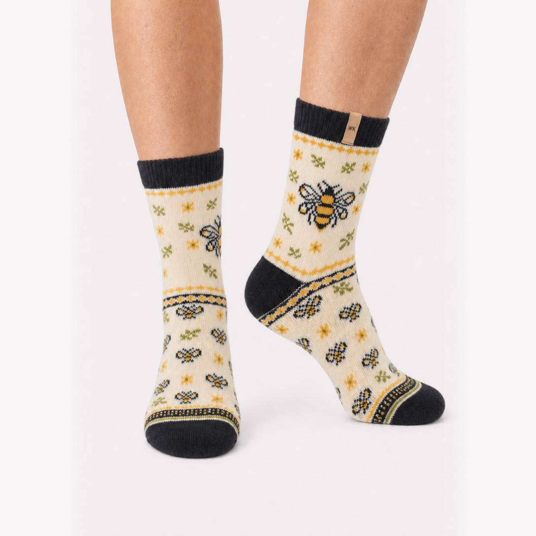 Honey Garden merino wool crew socks for women, bees and gold flowers on undyed cream with a charcoal cuff and heel