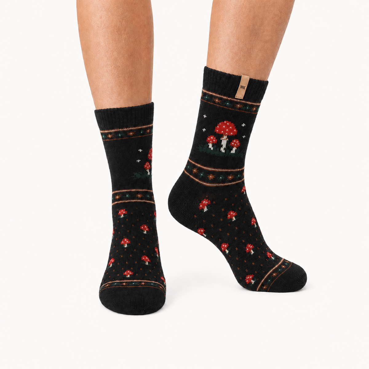 Mushroom Grove merino wool crew socks for women, red-capped mushrooms on black with fine copper banding