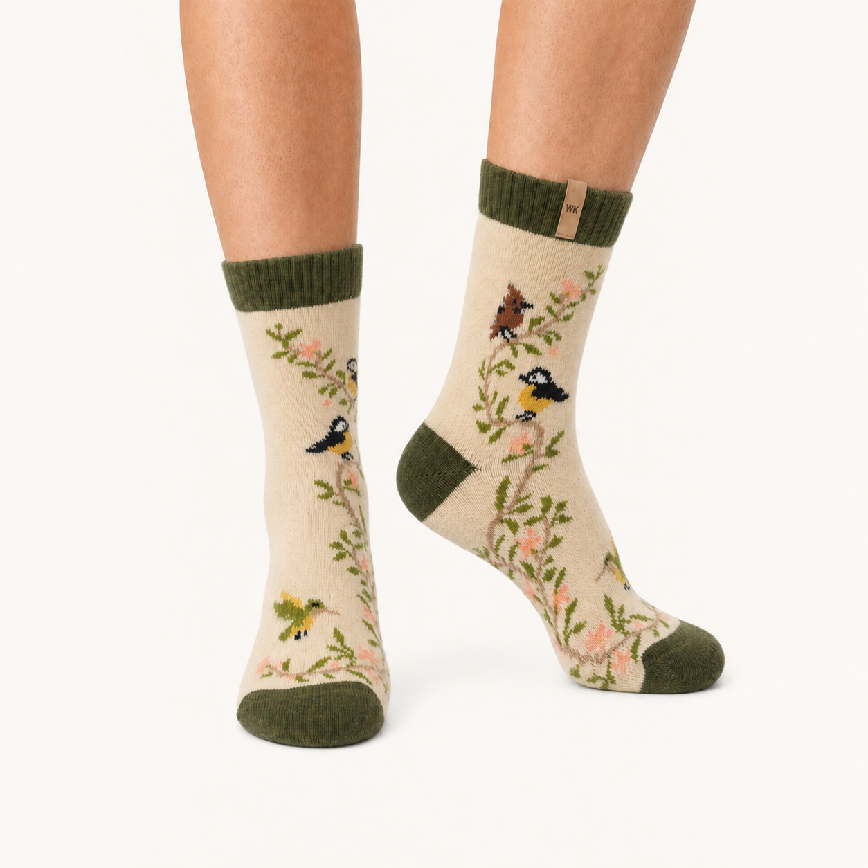 Songbird Vine merino wool crew socks for women, songbirds on a flowering branch with an olive cuff and heel